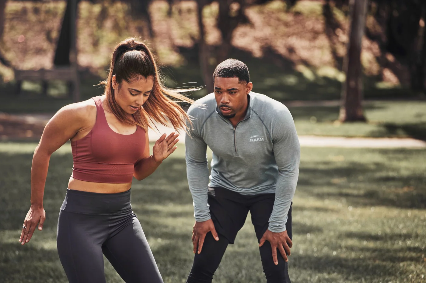 NASM trainer coaching outdoor sprint work